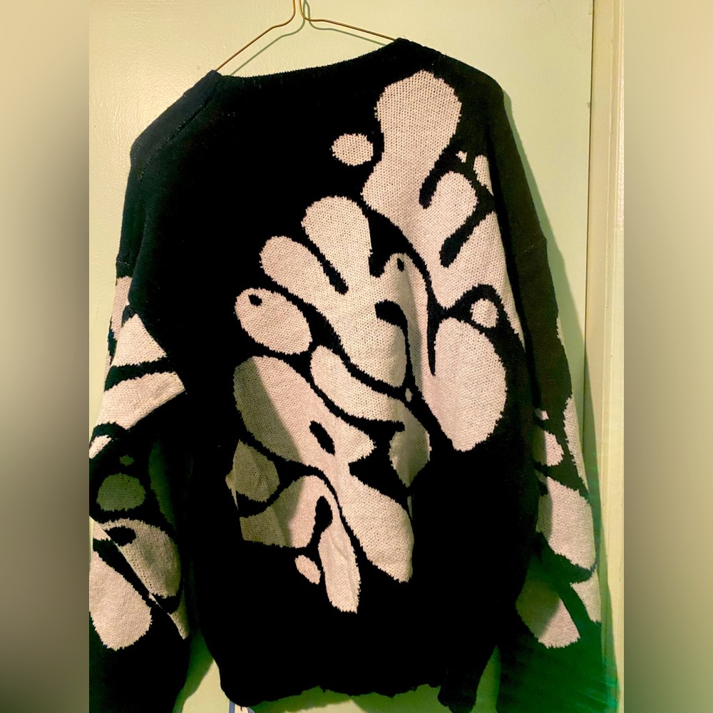 It’s a cozy sweater embroidery stitched.